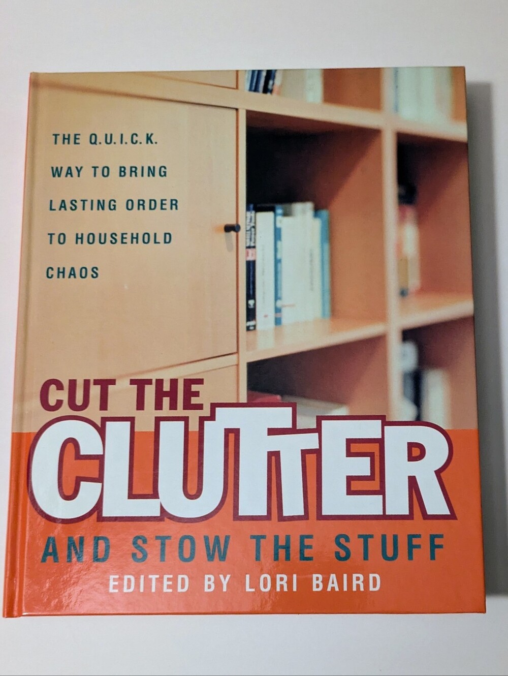 Book Cut The Clutter and Stow The Stuff  Book with Orange & Cream Cover